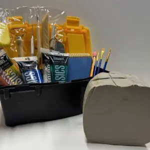 A basket of school supplies sitting next to a box.