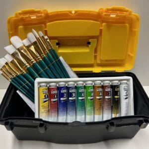 A yellow box with paint brushes and paints in it.