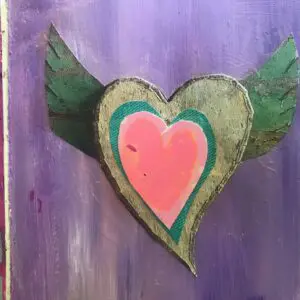 A heart with wings painted on it.