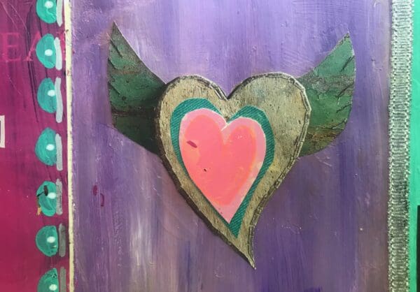 A heart with wings painted on it.